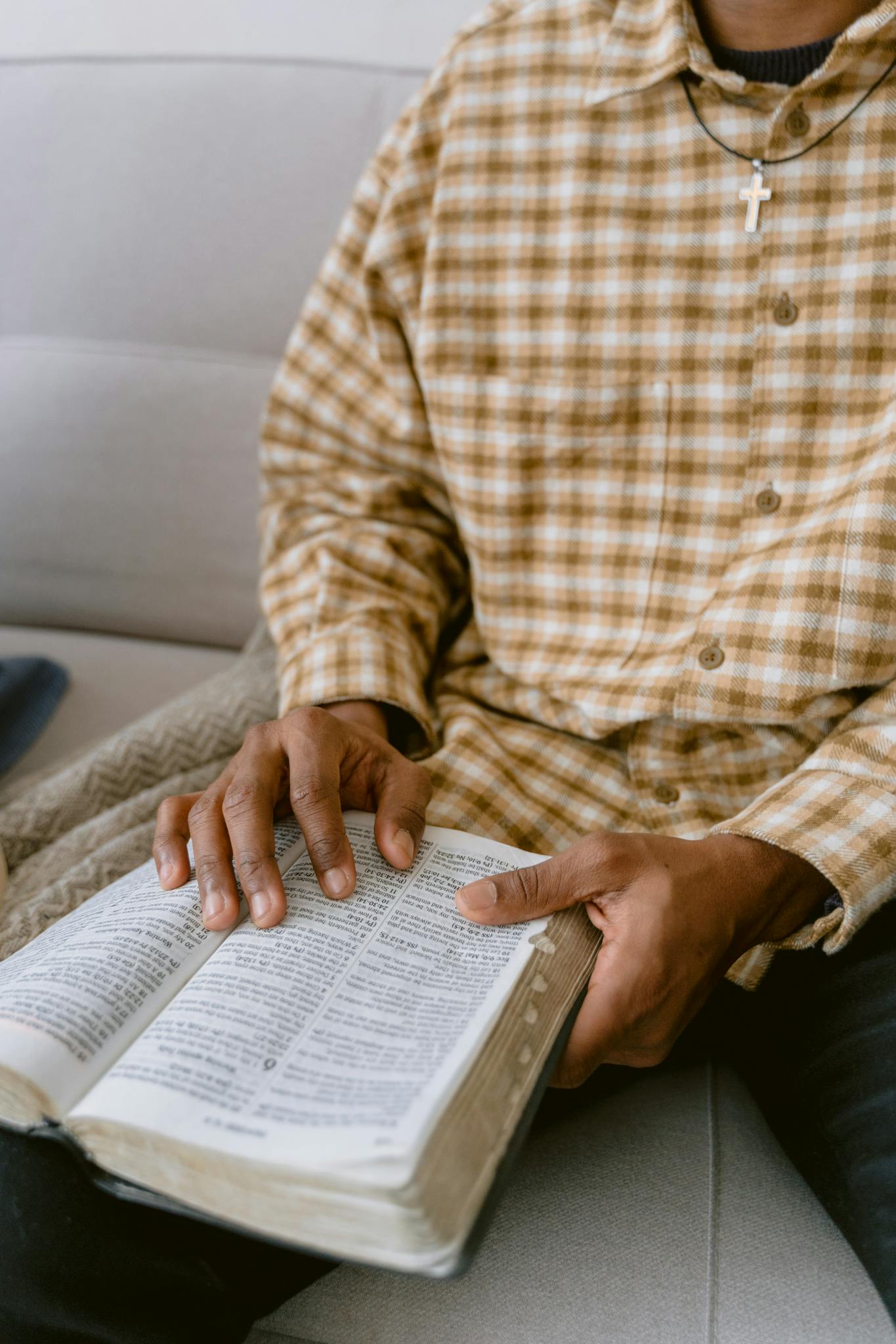 A close-up of a man reading a Bible. Bible Study Planet's Bible study methods can help gain deeper understanding of Scripture.